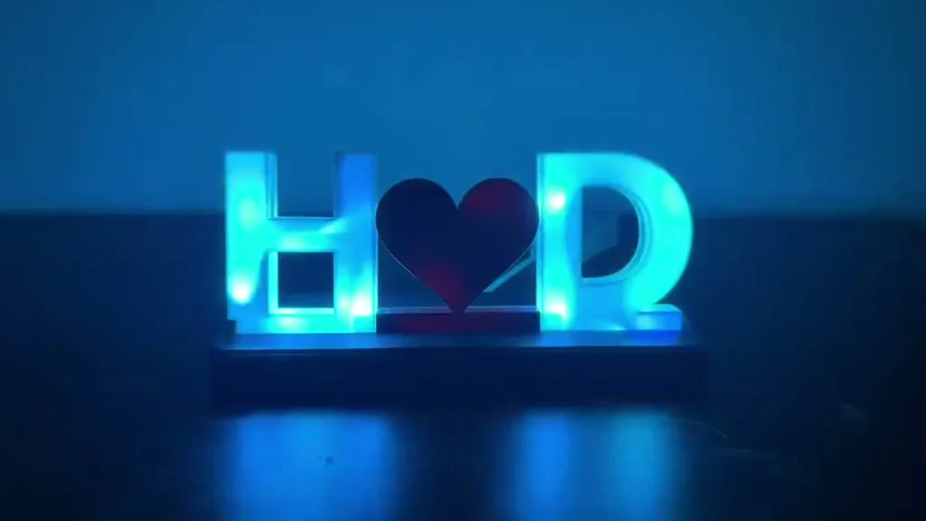 Initials name lamp reading H, heart, D, glowing ice blue