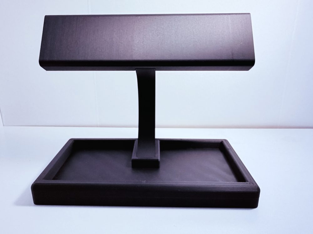 Empty watch and sunglasses valet stand with no watches or sunglasses